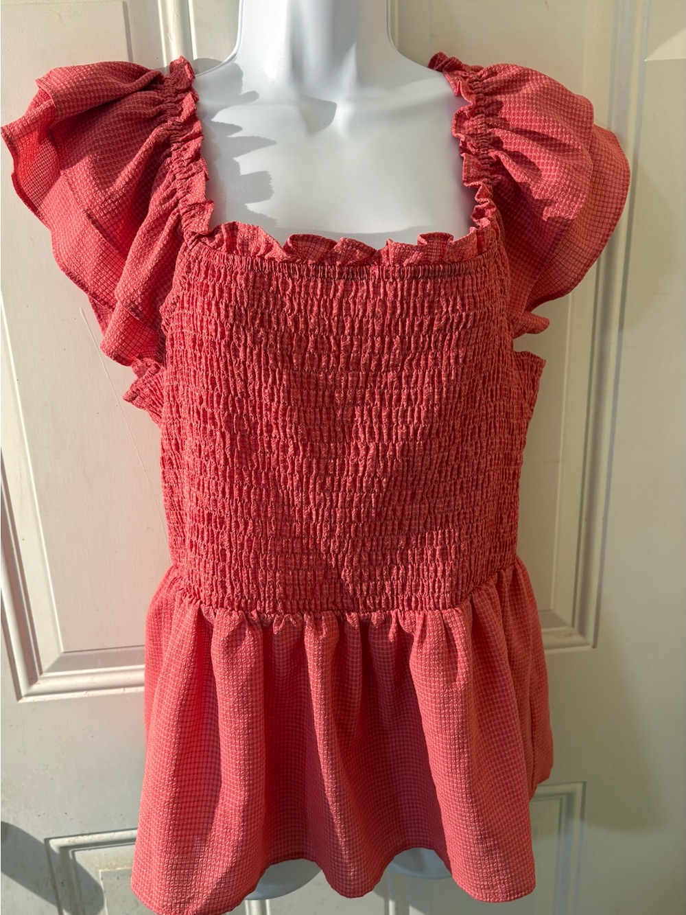Smocked Coral Peplum Tunic with Ruffle Cap Sleeves